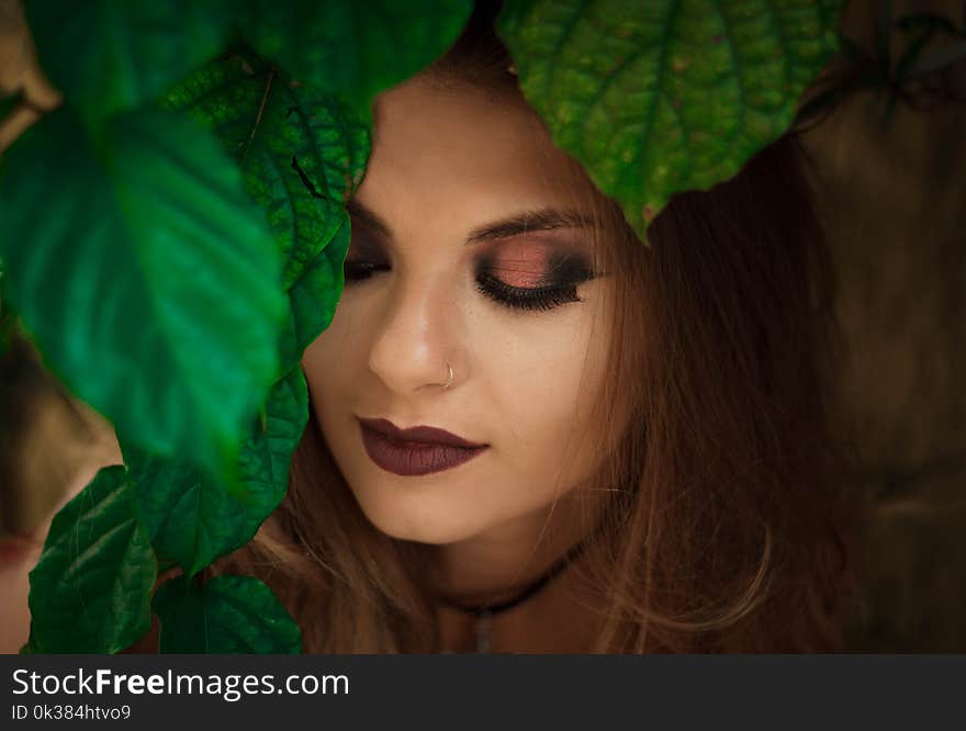 Shallow Focus Photography of Woman Near Leafy Tree