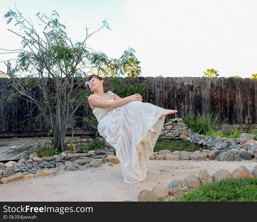 Woman Wearing White Spaghetti Strap Dress