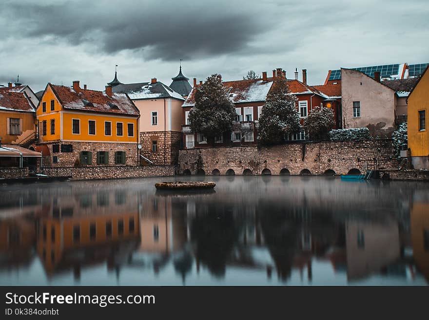 Bodies of Water Near Houses Photography