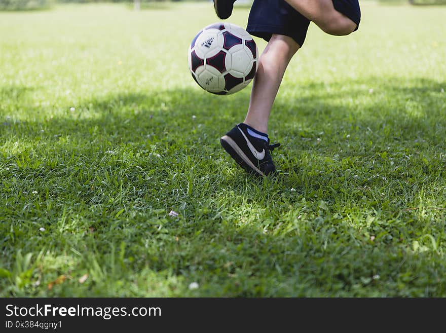 Person Wearing Black Nike Low-tops Sneakers Playing Soccer