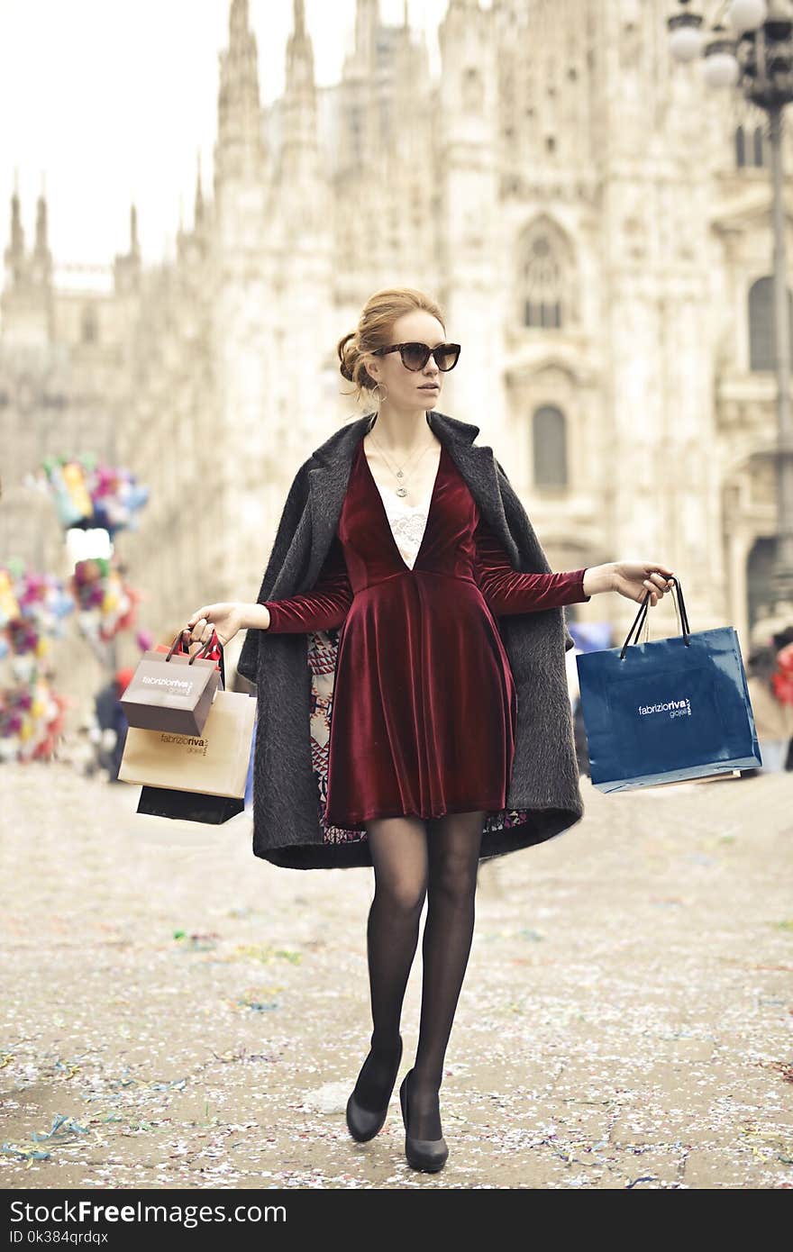 Photo of a Woman Holding Shopping Bags