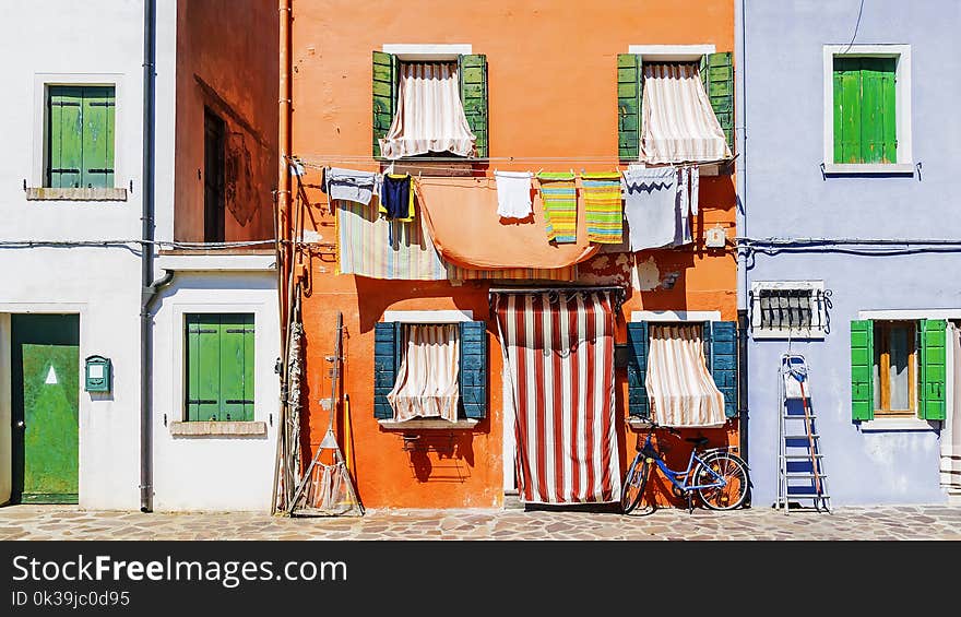 Picturesque facades of houses in the island of Burano, Venice