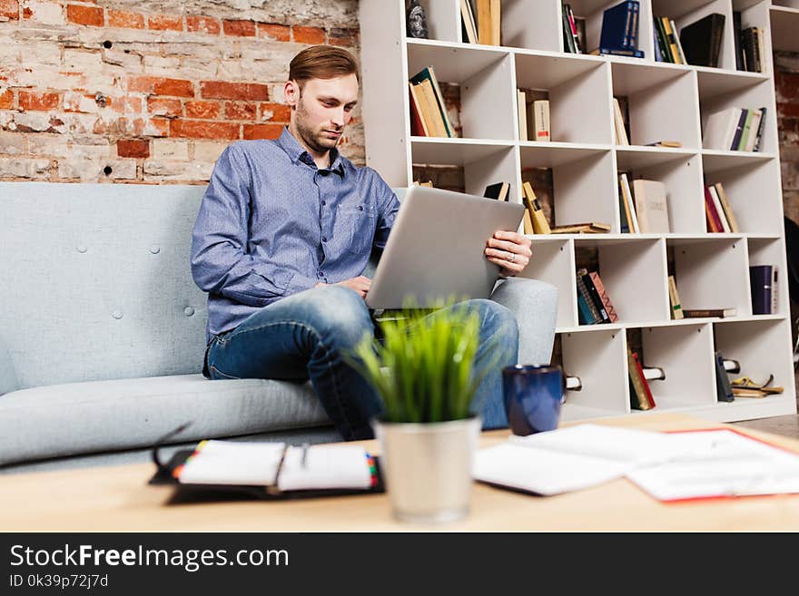 Young man working on laptop. Young man working on laptop