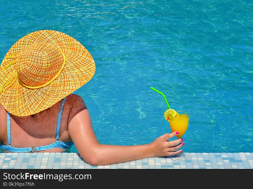 Real female beauty relaxing in swimming pool