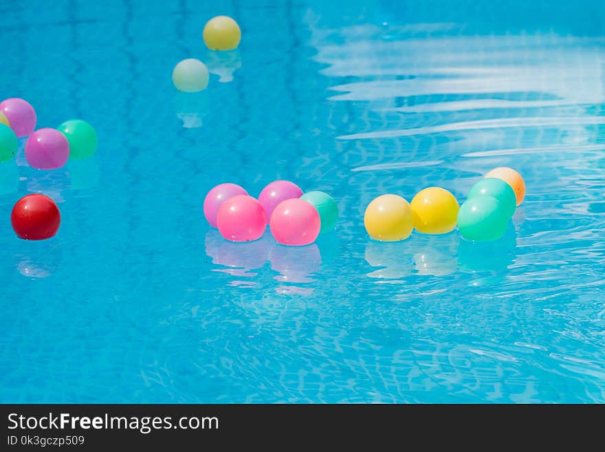 Colorful plastic balls in swimming pool.