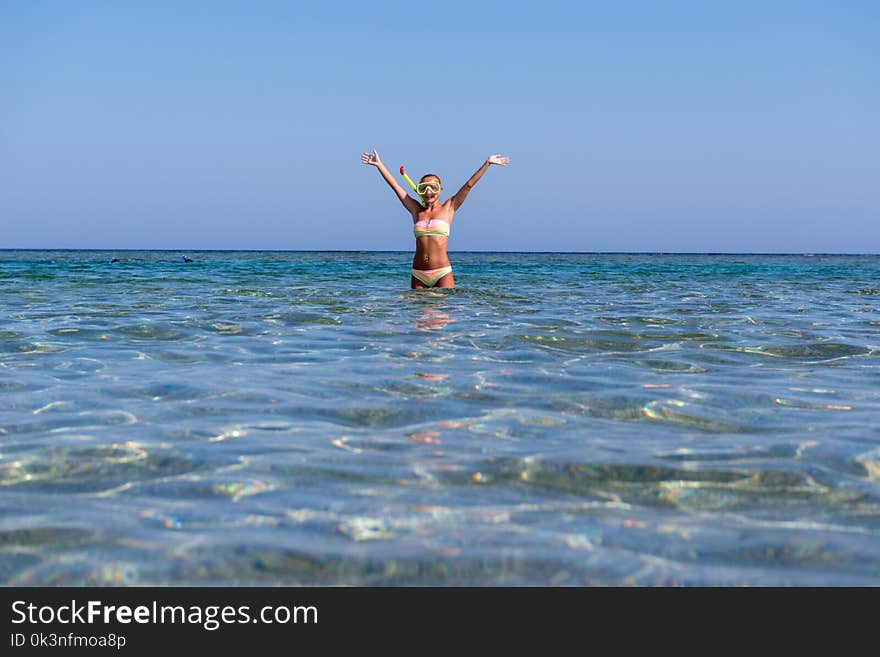 Cheerful woman wearing snorkeling mask