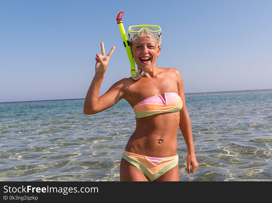 Cheerful woman wearing snorkeling mask