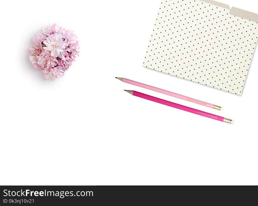 Pink Petaled Flower Beside Two Pink Pens