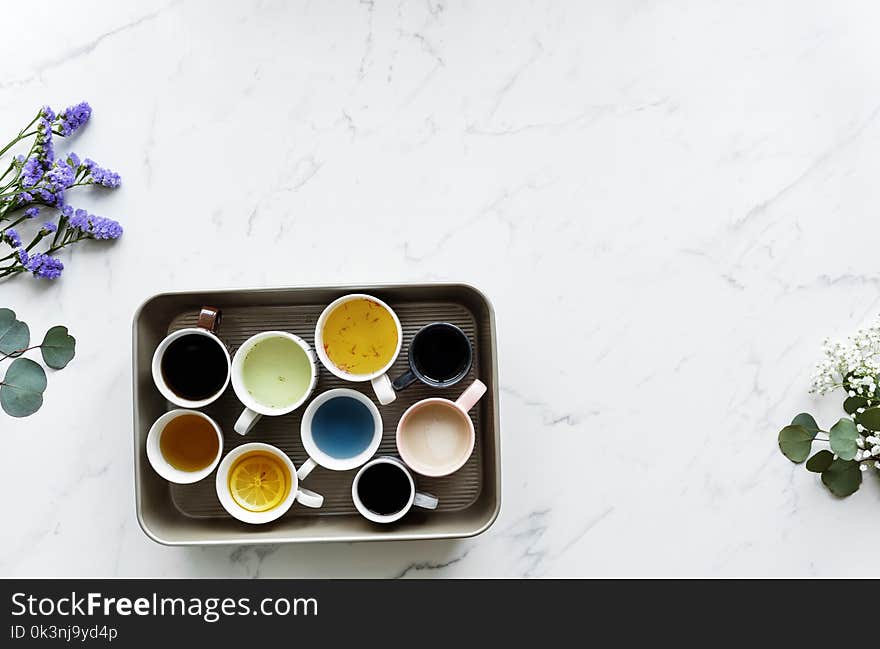 Nine White Ceramic Mugs