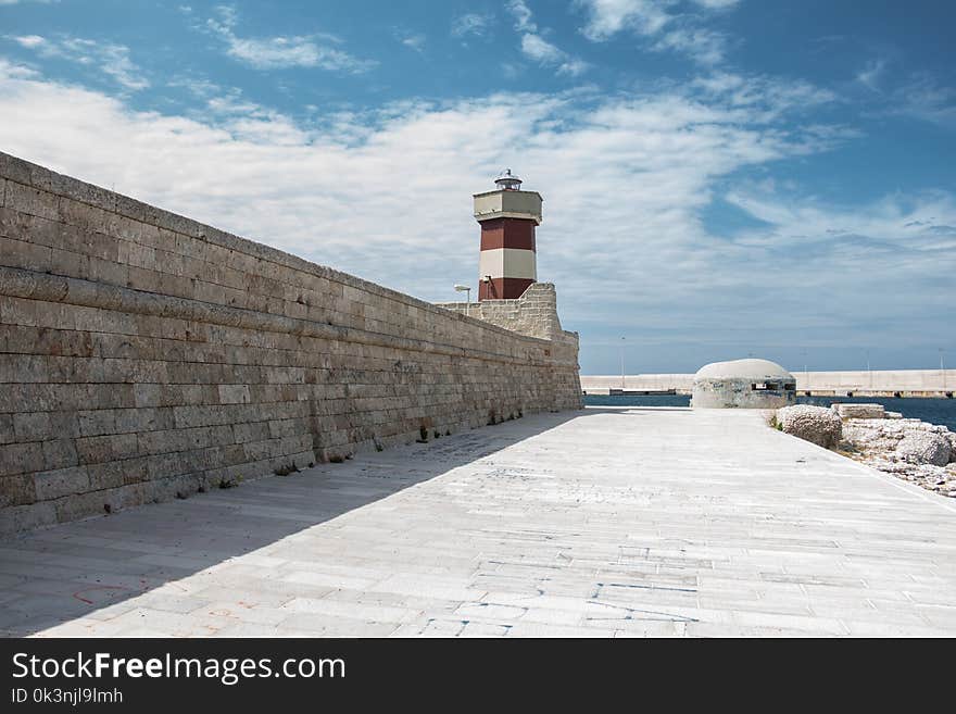 Brown and White Striped Lighthouse