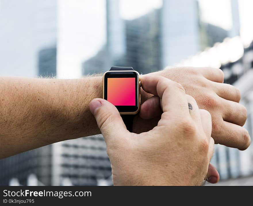 Person Wearing Watch and Adjusting Watch