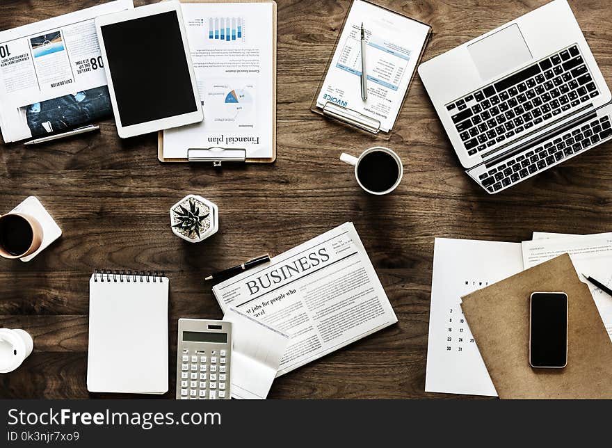 Silver Macbook Beside White Ceramic Mug on Table