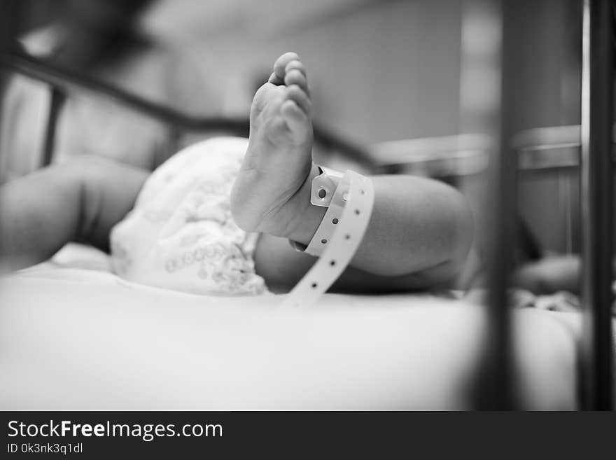 Grayscale Photography of Baby Laying