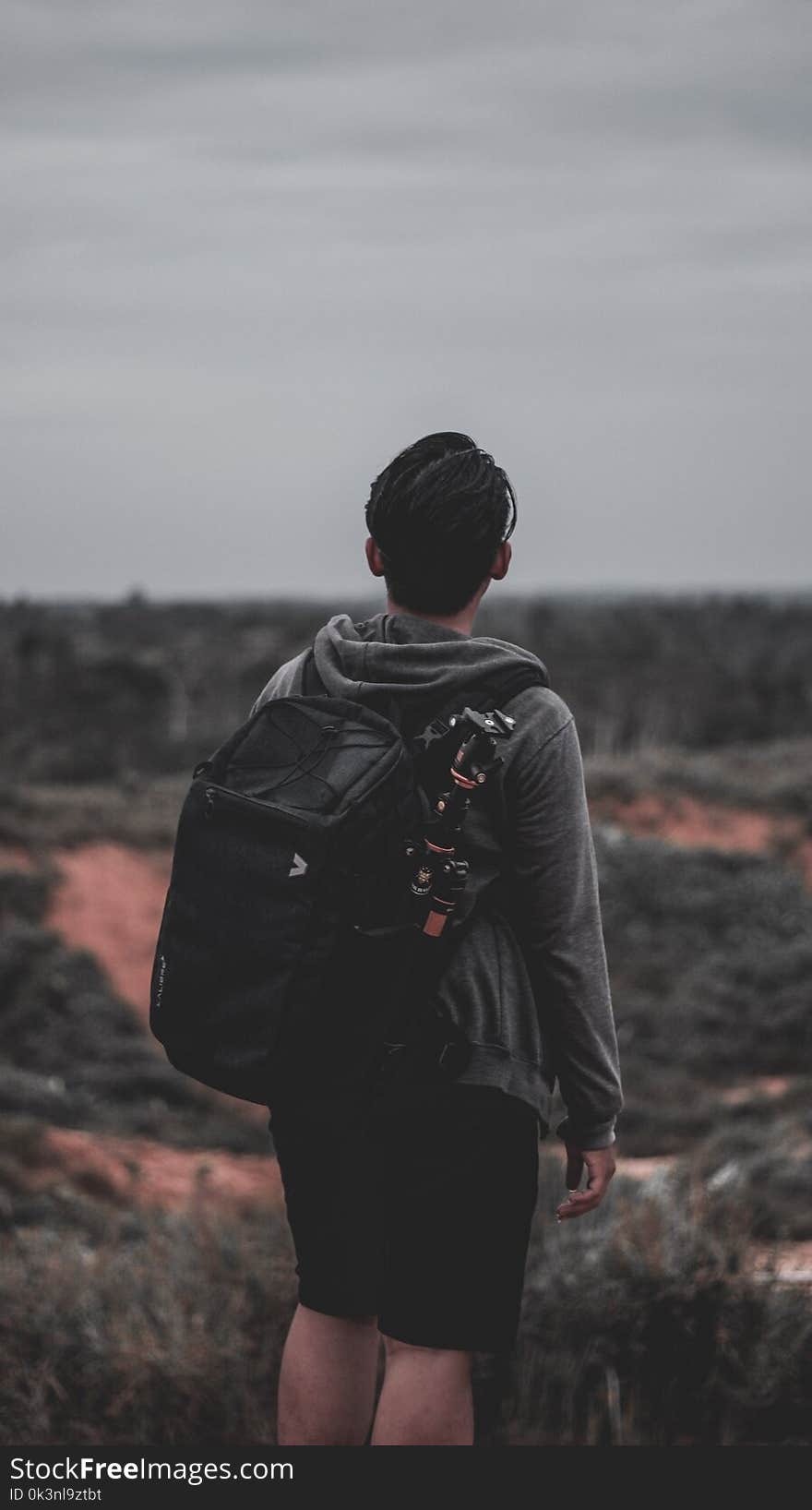 Photo of a Man Wearing Black Backpack