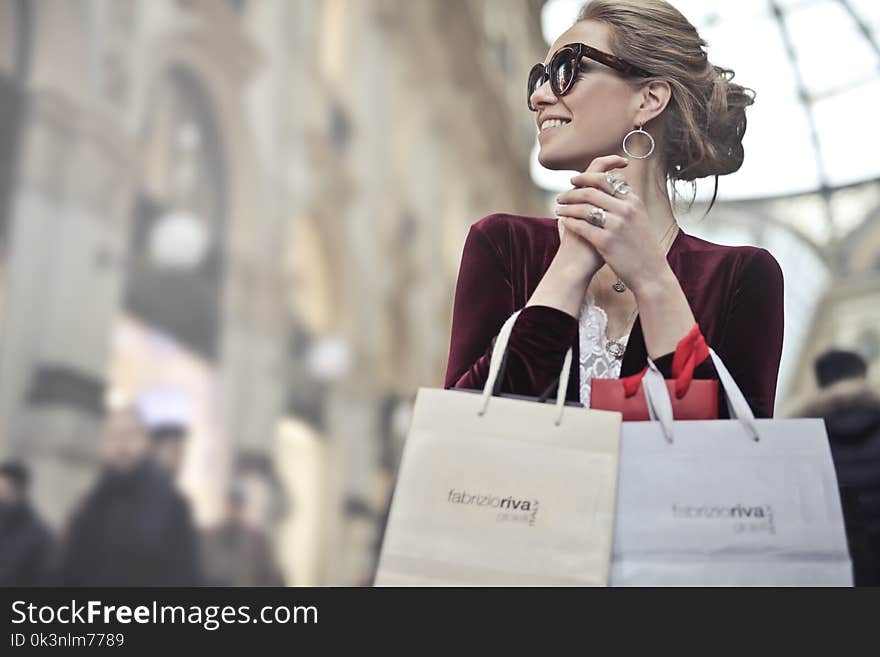 Photo of a Woman Holding Shopping Bags