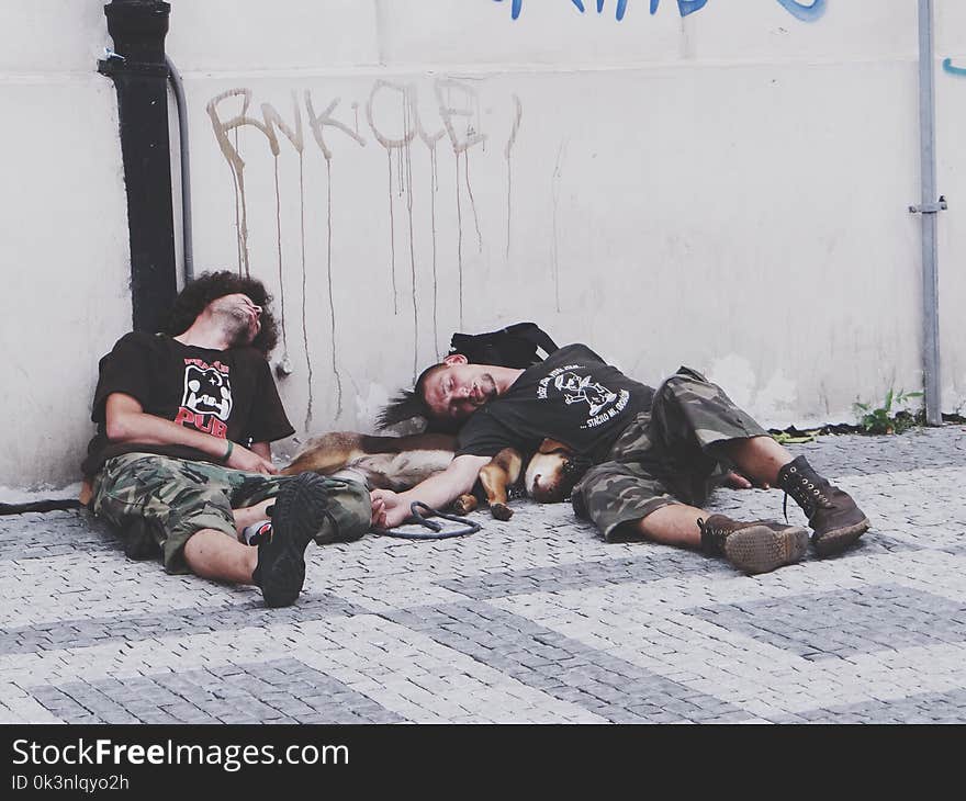 Photo of Men Sleeping on the Street