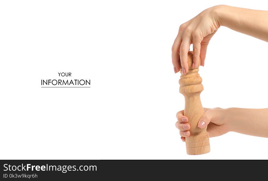 Pepper mill wooden in hand pattern on white background isolation