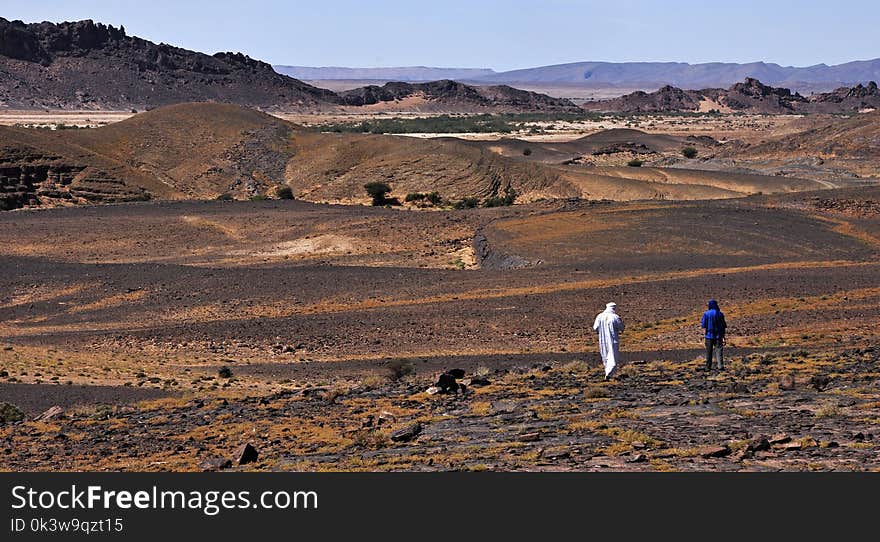 Two men goes to the rocky, hot and dry Sahara Desert in Morocco. Two men goes to the rocky, hot and dry Sahara Desert in Morocco.