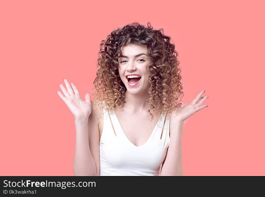 Beautiful Young Girl With Incredible Curls Smiles Surprised