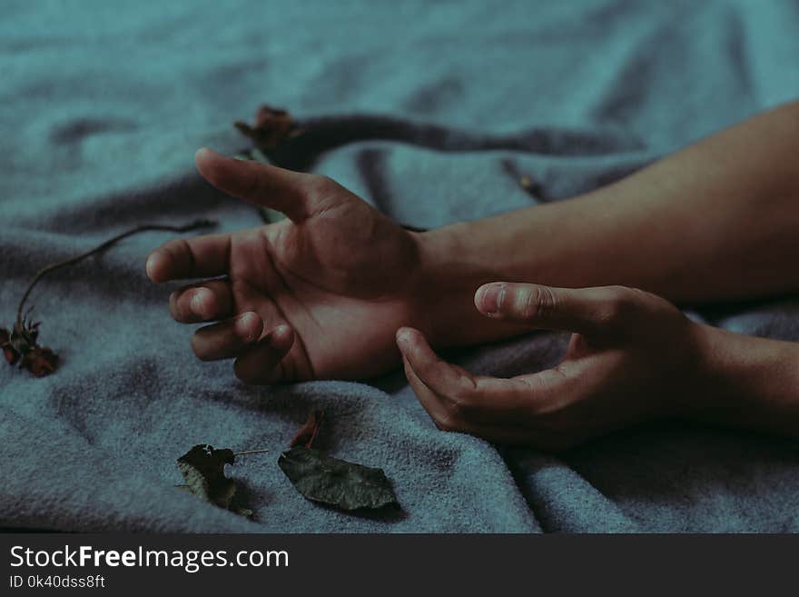 Person Lying on Gray Textile