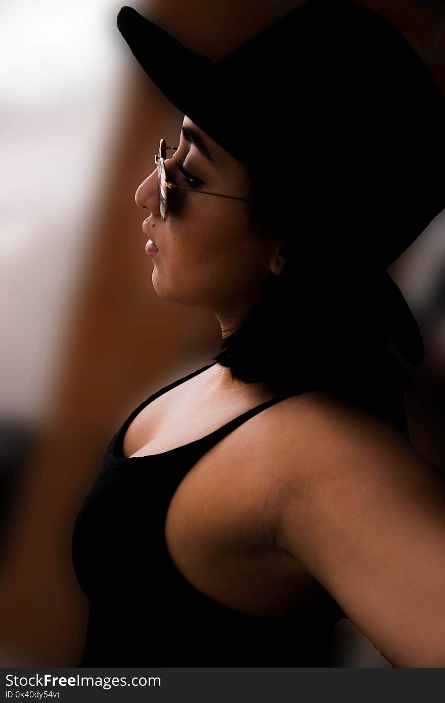 Woman Wearing Black Tank Top and Sunglasses