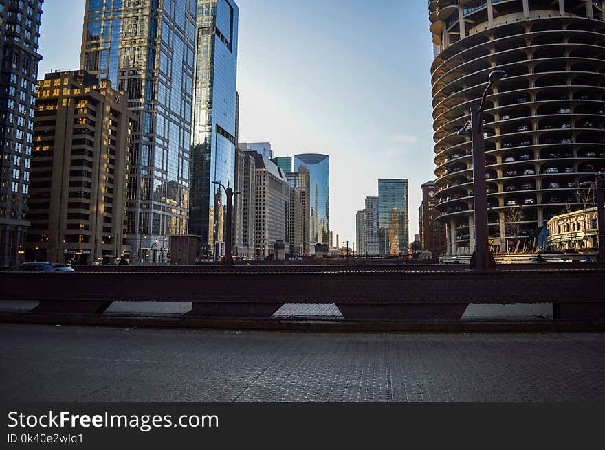 High Rise Buildings Under White Clouds and Blue Sky