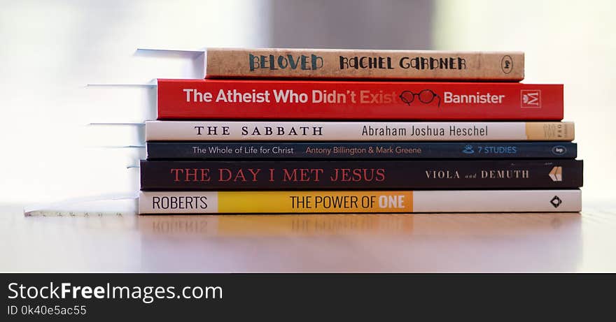 Six Assorted-title Books on White Desk