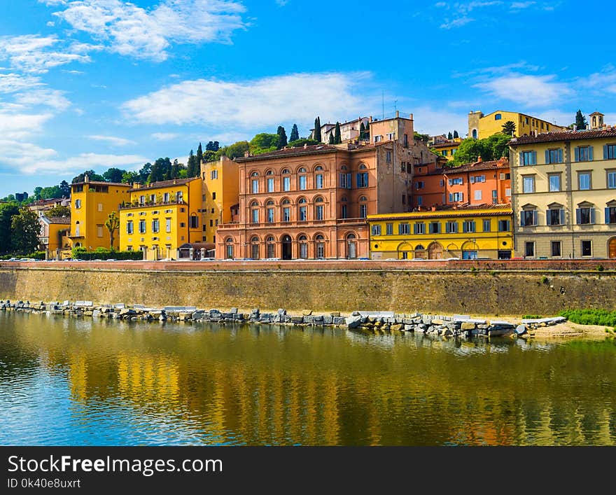 Yellow and Orange Buildings Near River