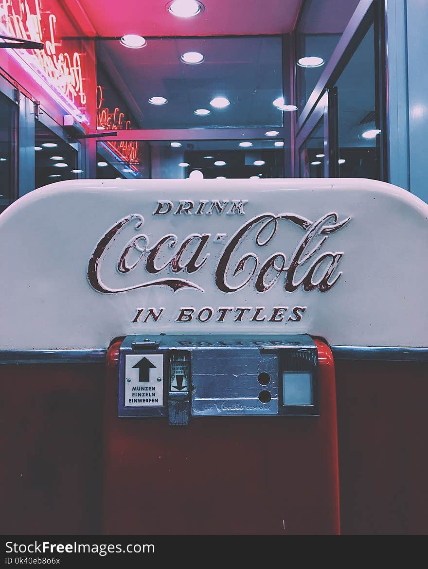 Red and White Drink Coca-cola in Bottle Dispenser