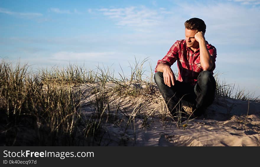 Shallow Focus Photography of Man Wearing Red Polo Shirt