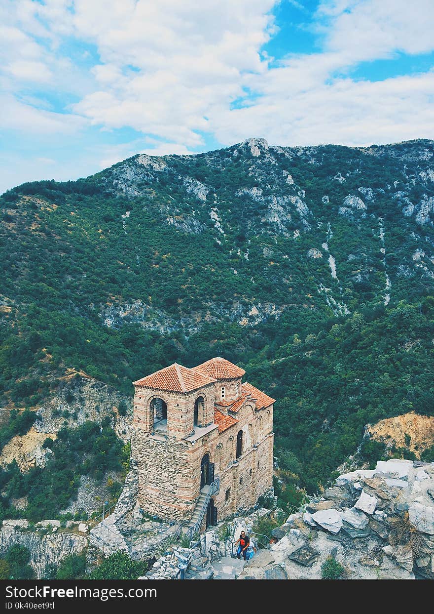 High Angle Photography of Brown Structure Surrounded by Mountains