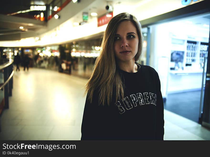 Woman Wearing Black Supreme Sweater