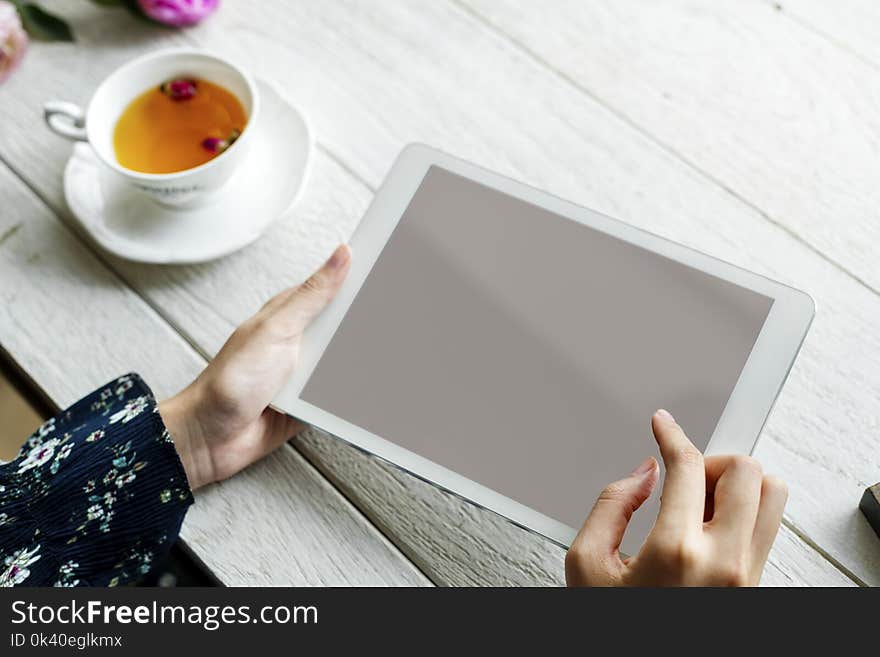 White Ipad on Hand