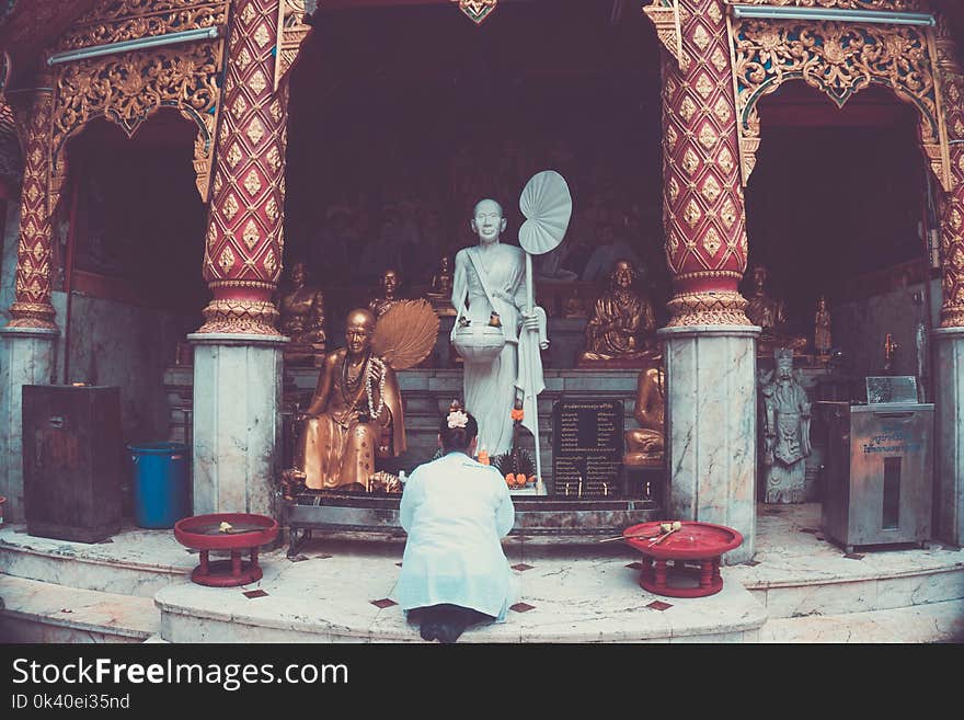 Gold and White Ceramic Religious Statues