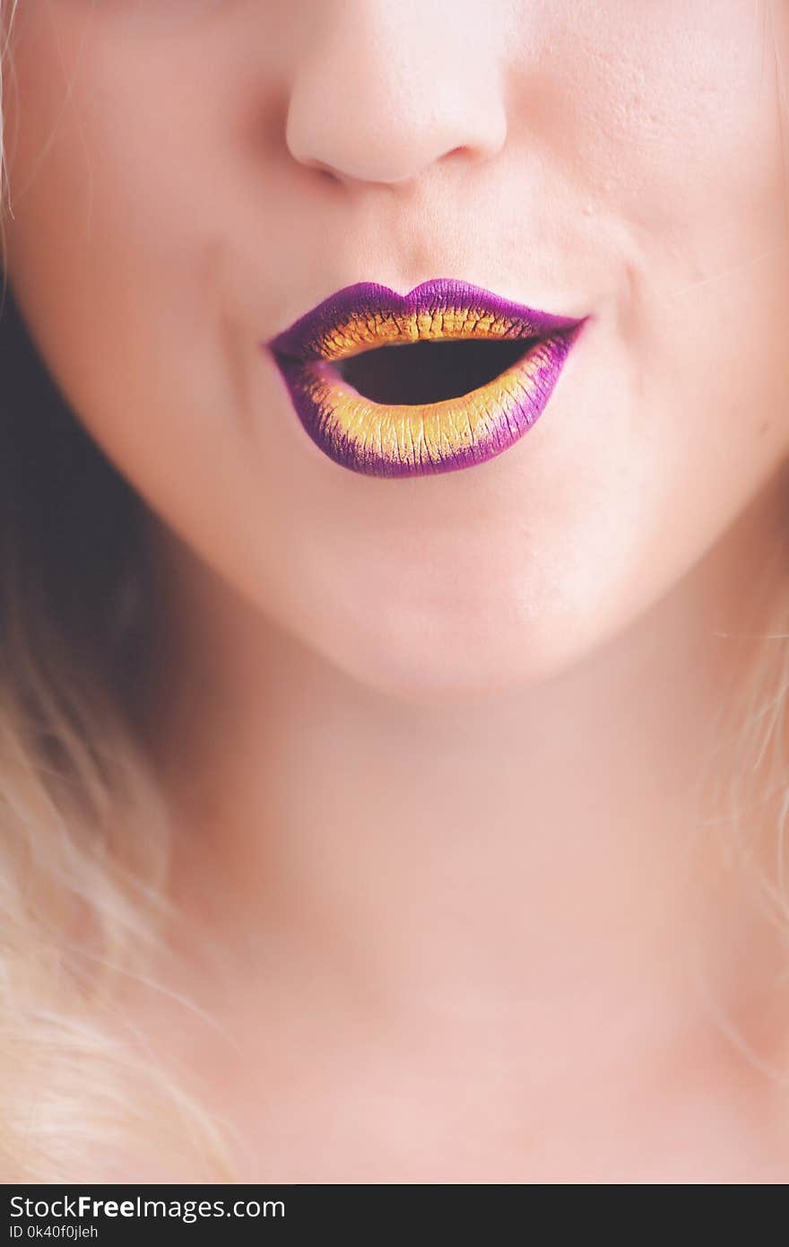 Woman With Purple and Yellow Lipstick