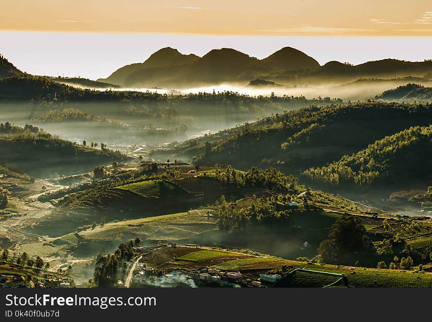 Green Mountain Under White Sky