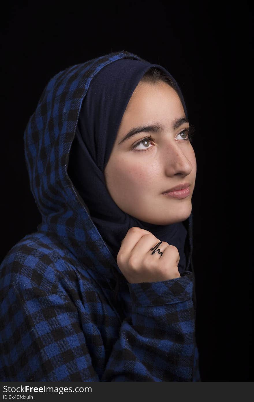 Woman in Black and Blue Plaid Headscarf