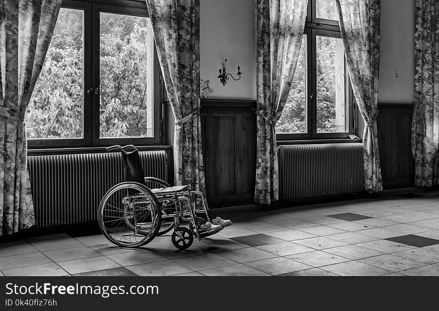 Grayscale Photo of Wheelchair