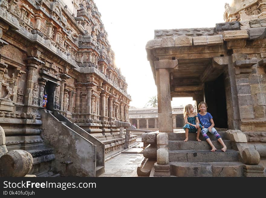 Two Girl&#x27;s Sitting on Gray Concrete Stair