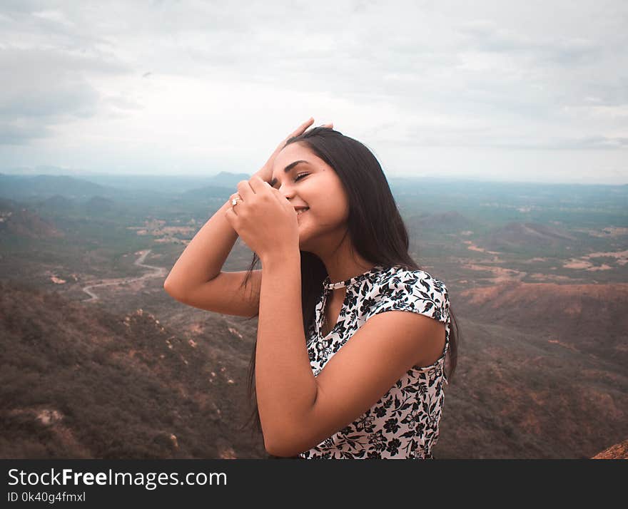 Woman Standing Peak of Mountain