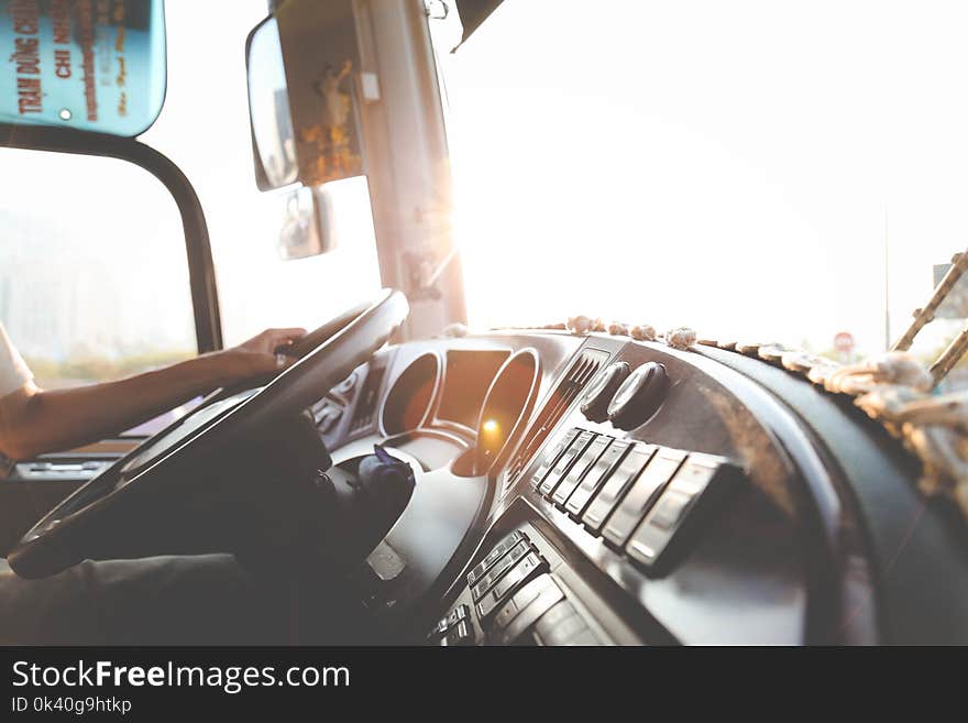 Person Hand On Steering Wheel