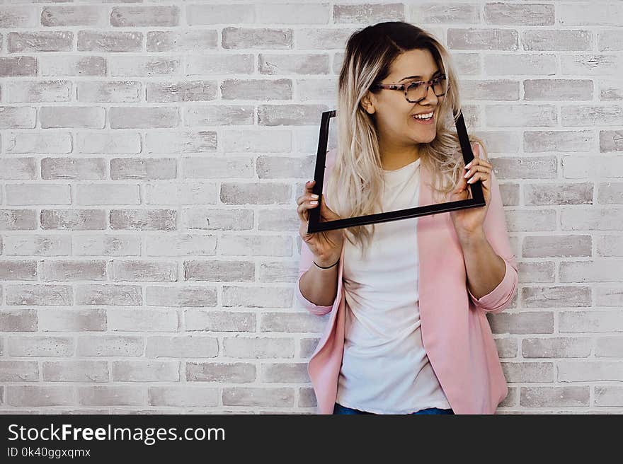 Woman Holding Black Photo Frame