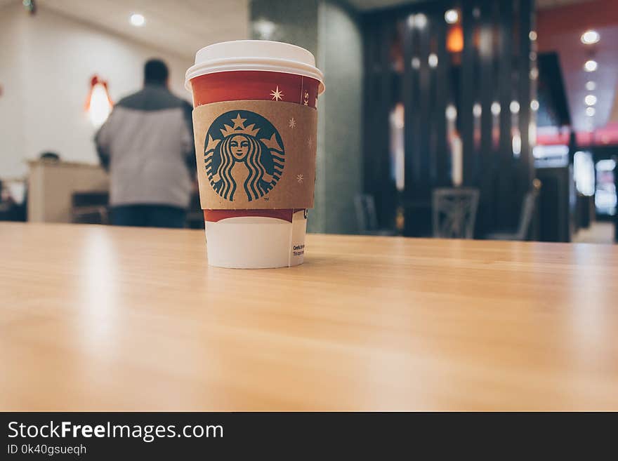 Photo of Paper Cup on Top of the Table