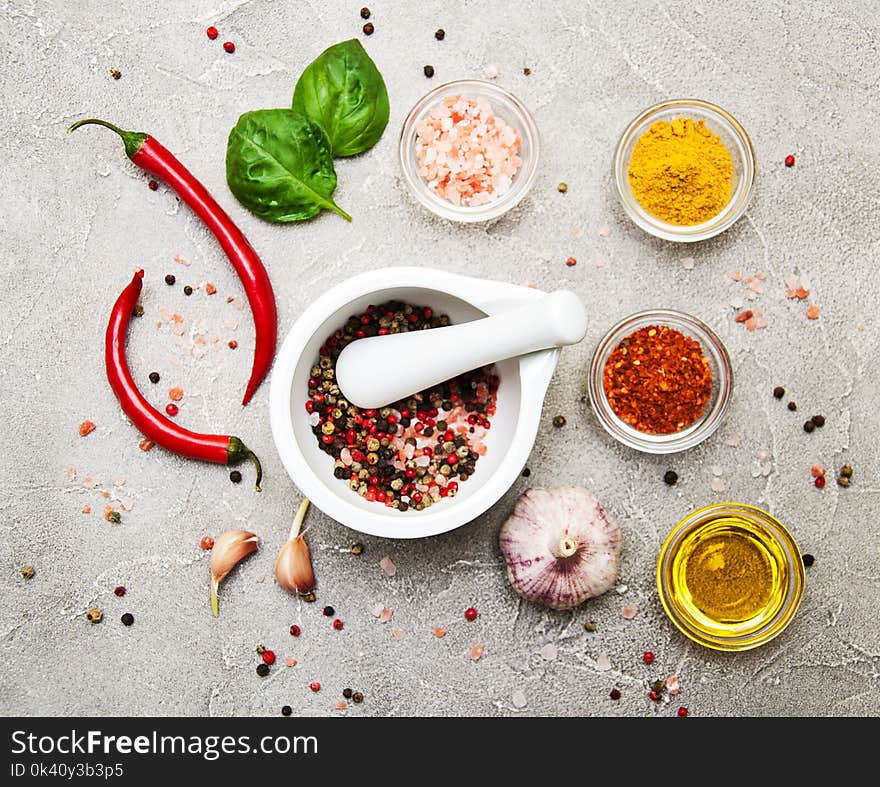 Different kind of spices on a stone background