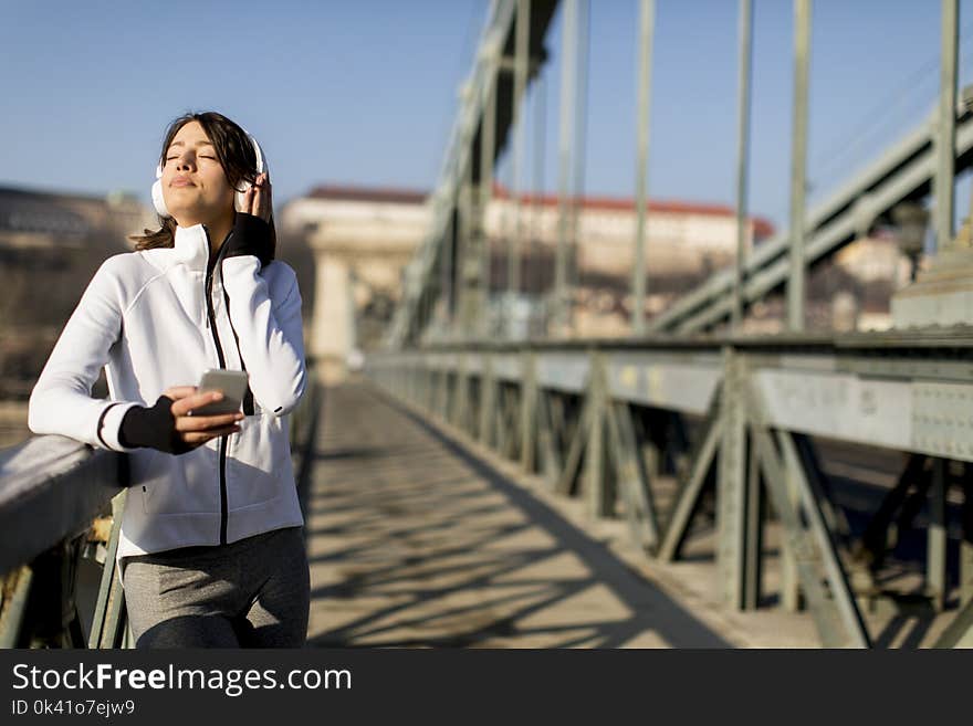 Woman On The Bridge Making A Pause After The Exercise