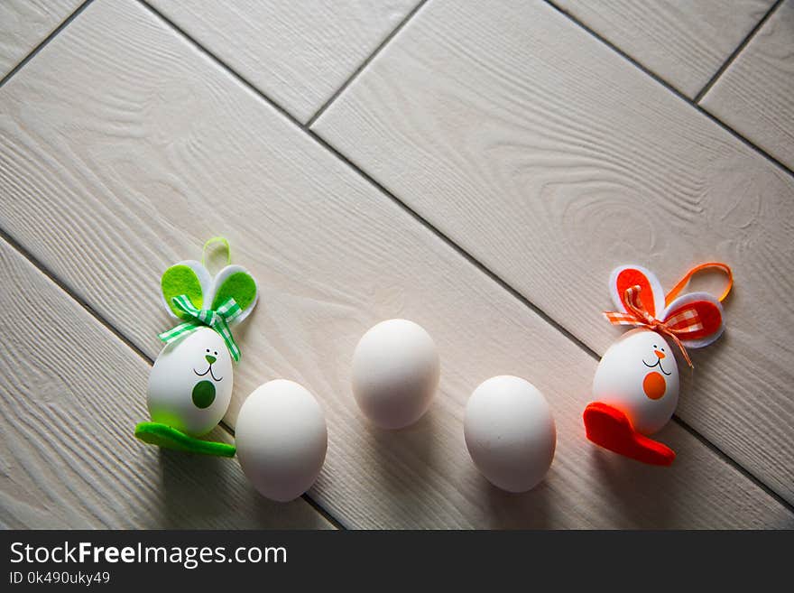 Easter eggs on wooden background. Happy Easter. Creative photo with easter eggs.Easter eggs on wooden background.Happy Easter.