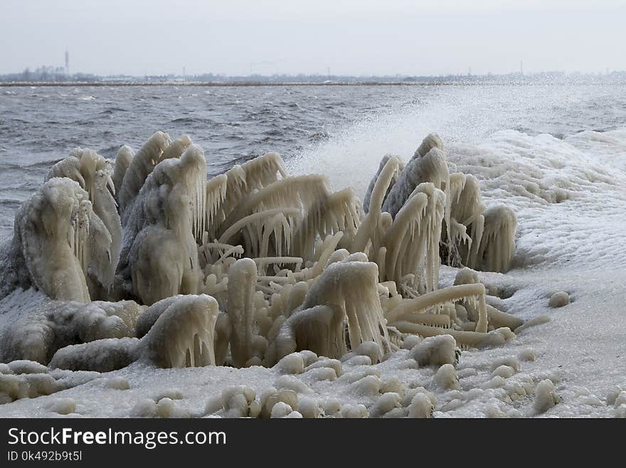 Icicles on the bank of a lake in the winter. Icicles on the bank of a lake in the winter