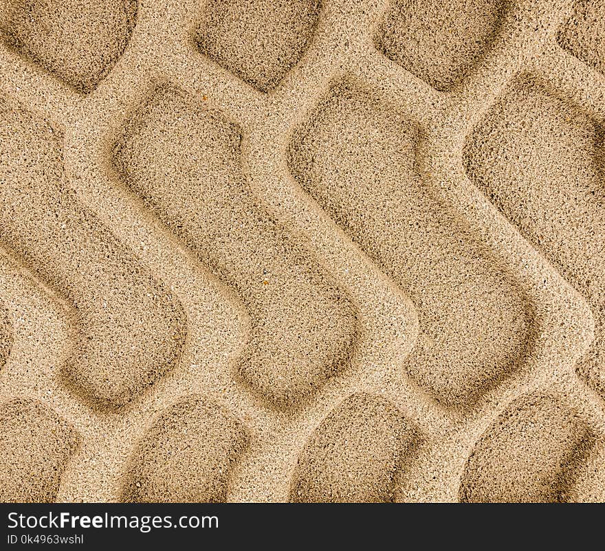 Big heavy tyre tracks embedded in sand. Big heavy tyre tracks embedded in sand