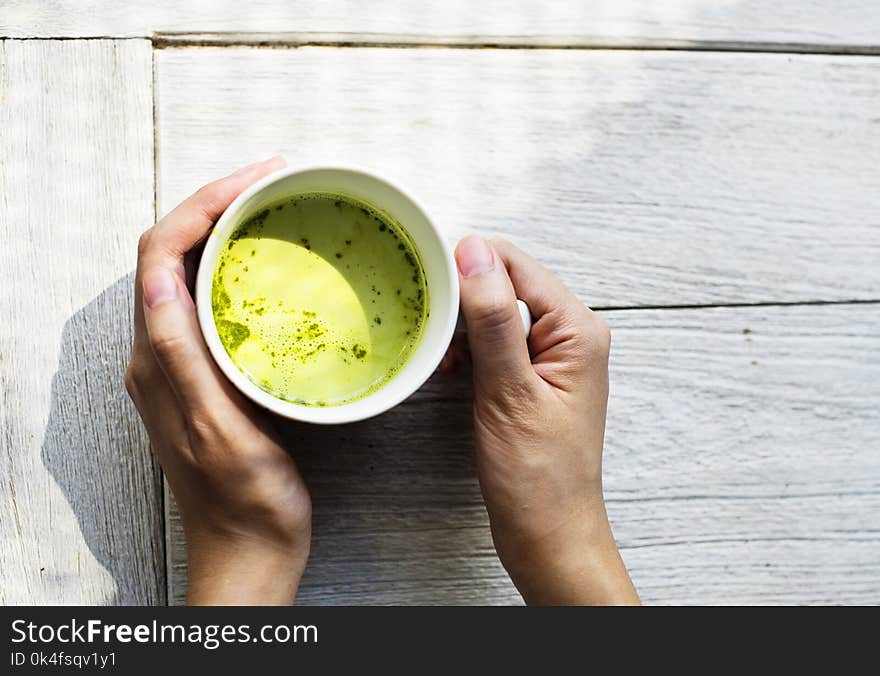 Person Holding White Ceramic Mug