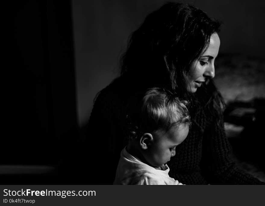 Grayscale Photography of Mother and Child